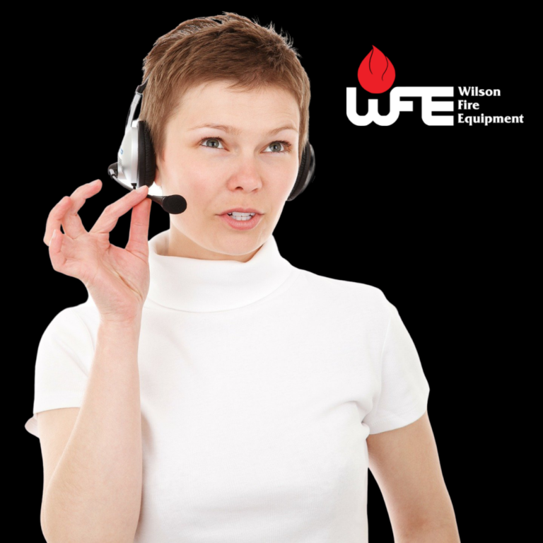 woman on headset for life safety and security systems monitoring in Houston