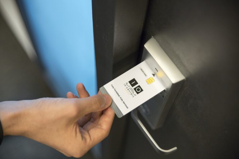 person using keycard for access control systems