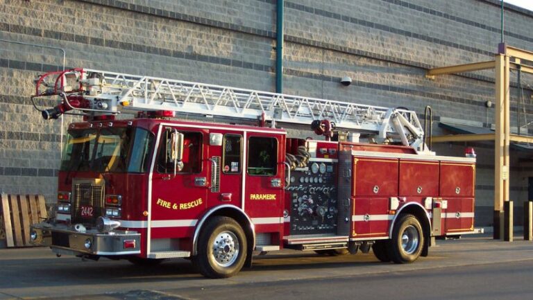 Fire truck outside building after responding to false alarm from life safety system